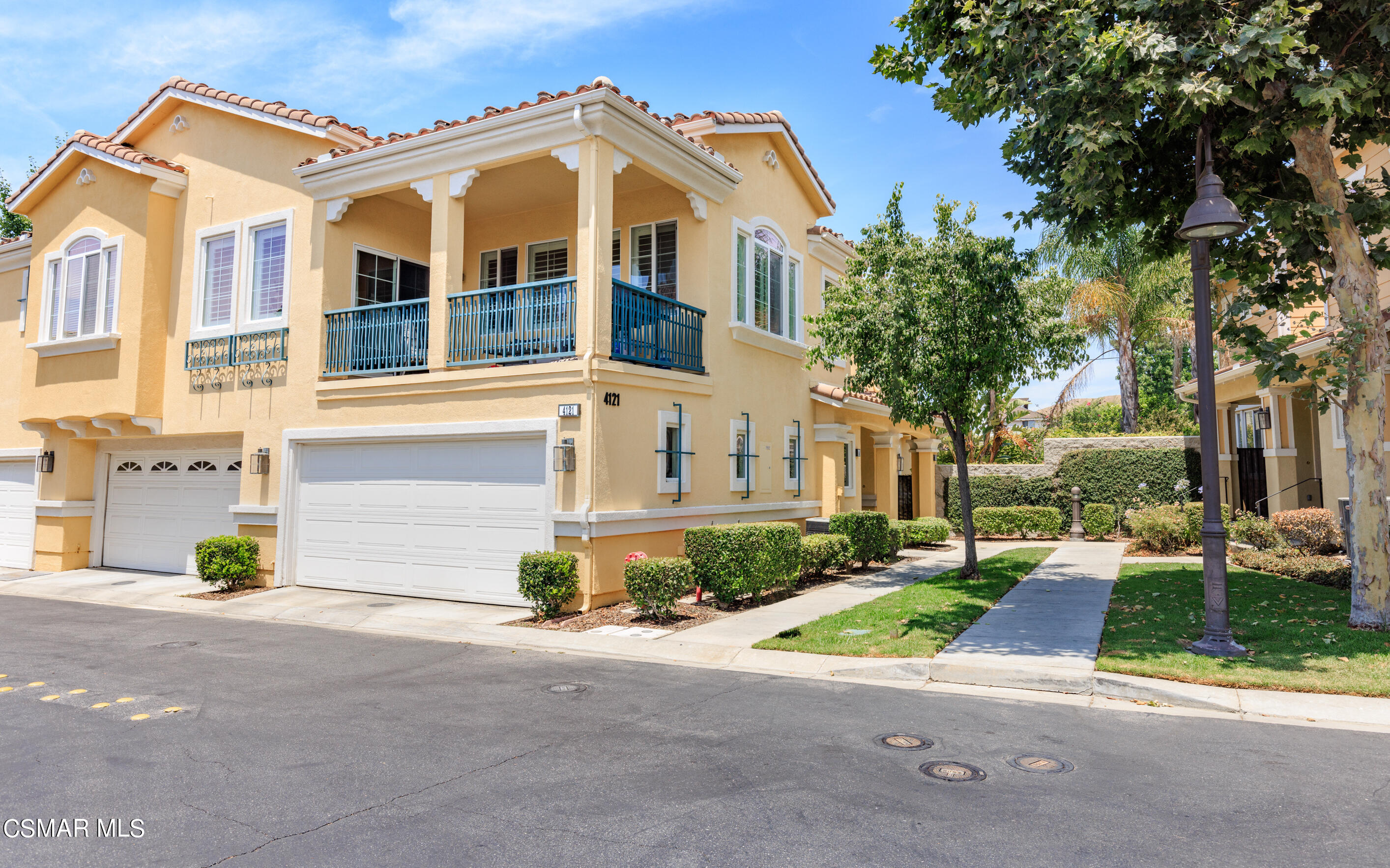 4121 Paredo Way, Unit A Simi Valley, CA 93063 - Photo 1 of 29 a front view of a house with a yard and garage