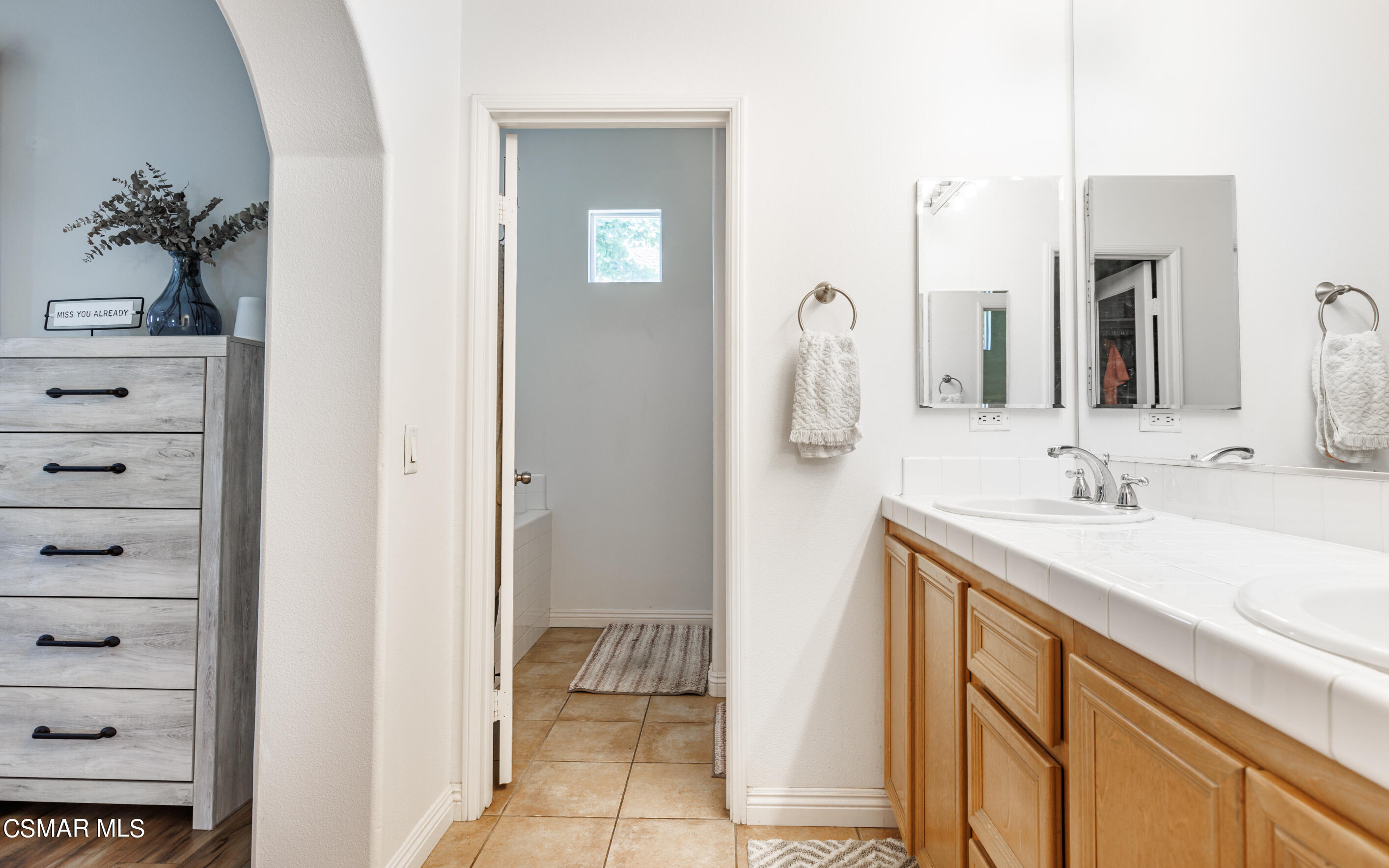 4121 Paredo Way, Unit A Simi Valley, CA 93063 - Photo 16 of 29 a bathroom with a sink and a mirror