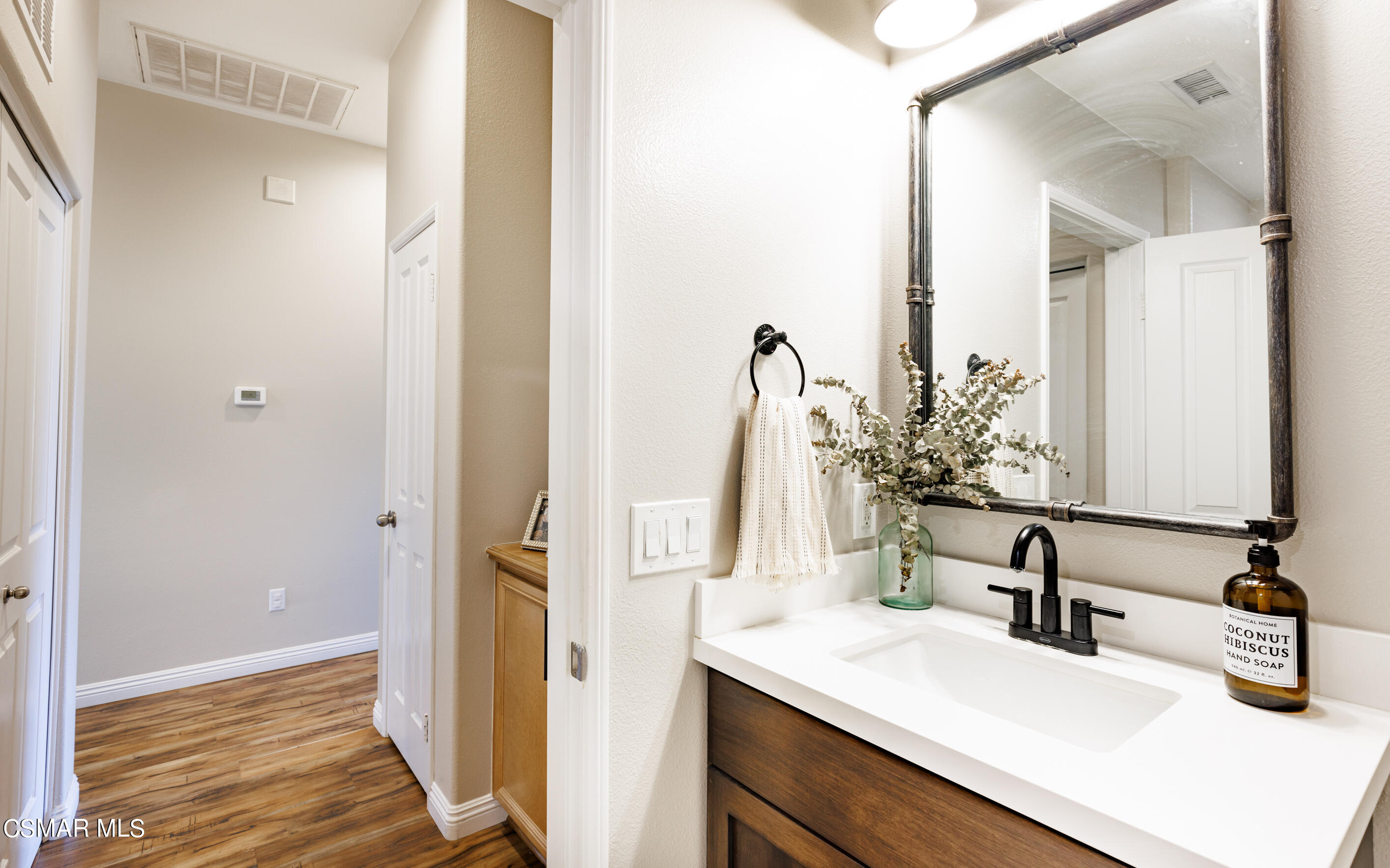 4121 Paredo Way, Unit A Simi Valley, CA 93063 - Photo 21 of 29 a bathroom with a sink and a mirror