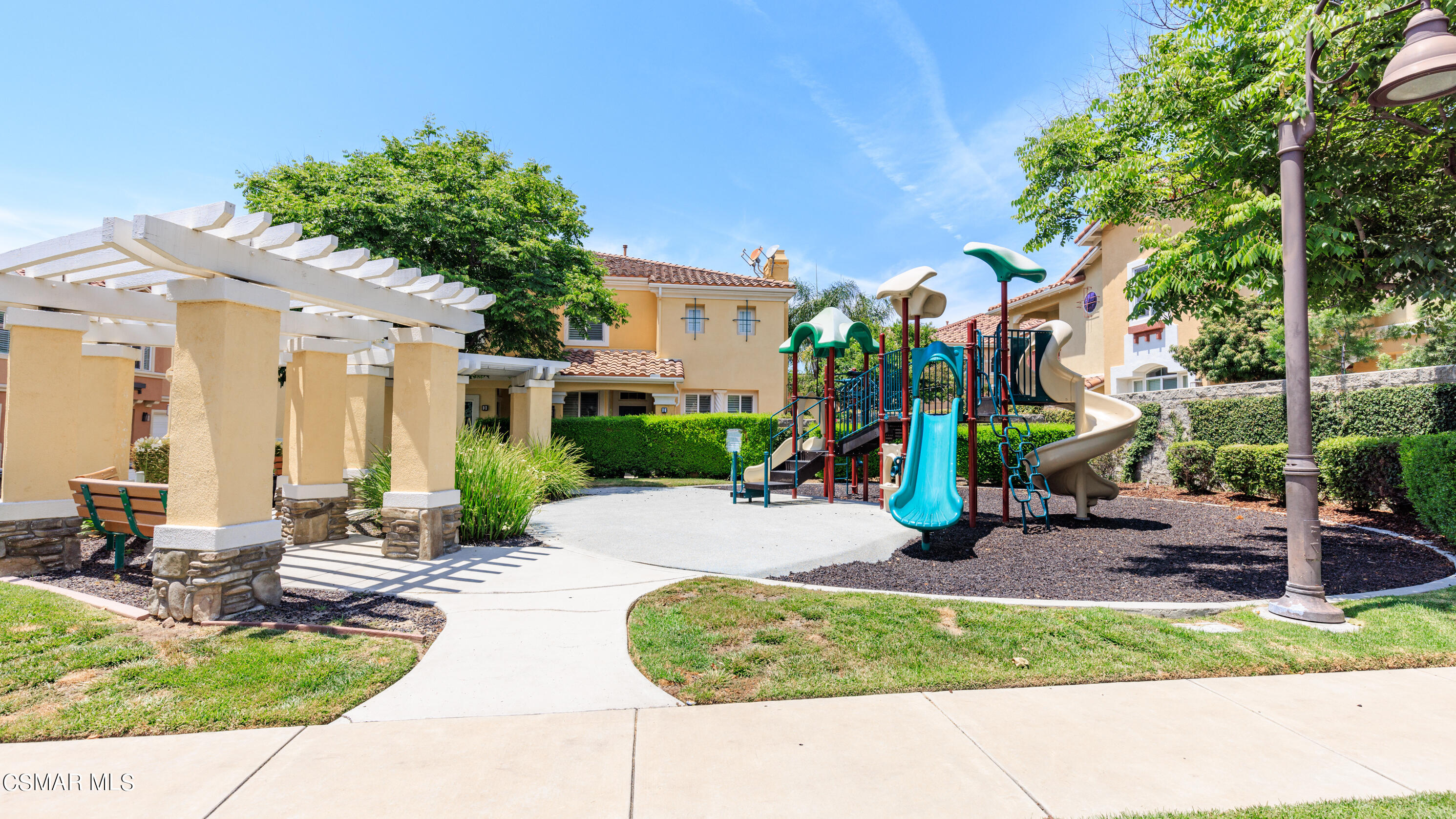 4121 Paredo Way, Unit A Simi Valley, CA 93063 - Photo 26 of 29 a view of a patio with a table and chairs under an umbrella