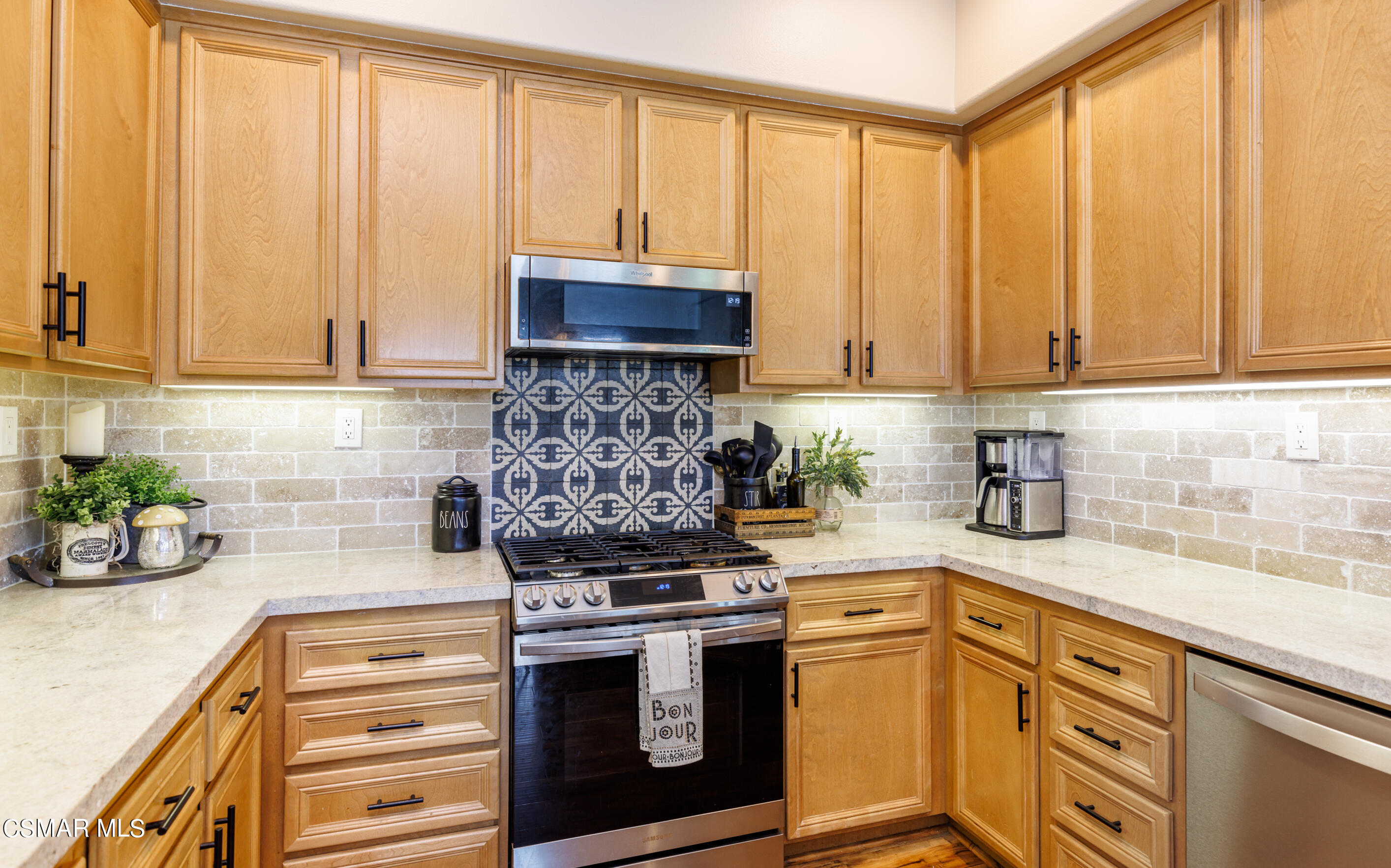 4121 Paredo Way, Unit A Simi Valley, CA 93063 - Photo 4 of 29 a kitchen with stainless steel appliances granite countertop a stove a sink and cabinets