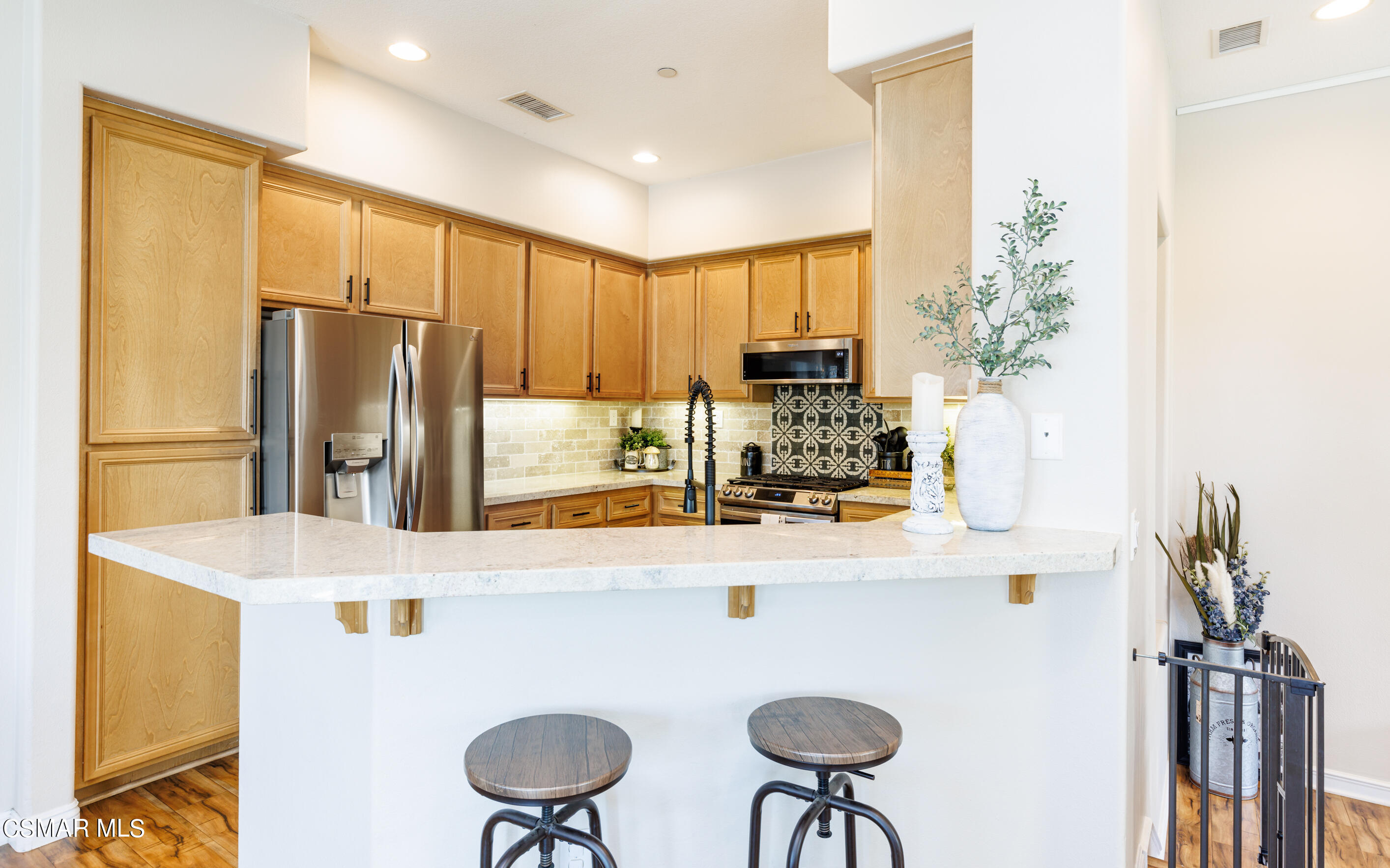 4121 Paredo Way, Unit A Simi Valley, CA 93063 - Photo 6 of 29 a kitchen with stainless steel appliances a refrigerator and a stove