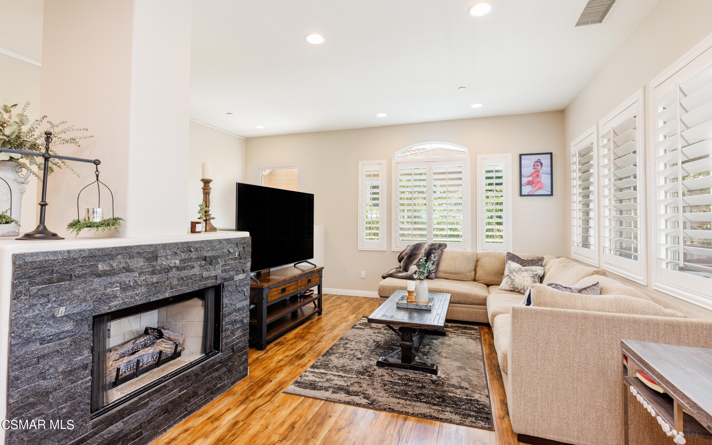 4121 Paredo Way, Unit A Simi Valley, CA 93063 - Photo 9 of 29 a living room with furniture and a fireplace