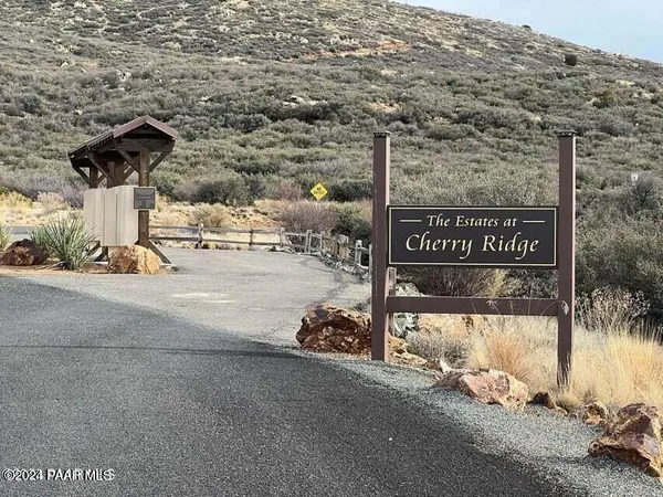 a view of a street with cars parked on road