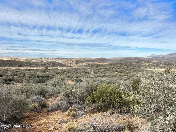 a view of a large building with lots of trees