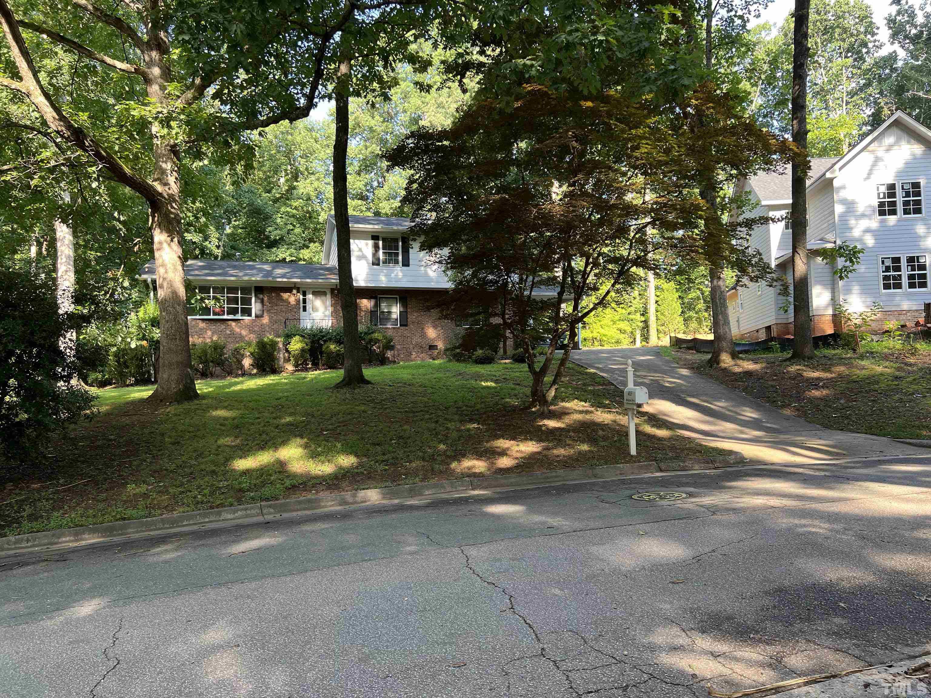 4113 Redington Drive Raleigh, NC 27609 - Photo 2 of 3 a view of a park with plants and trees
