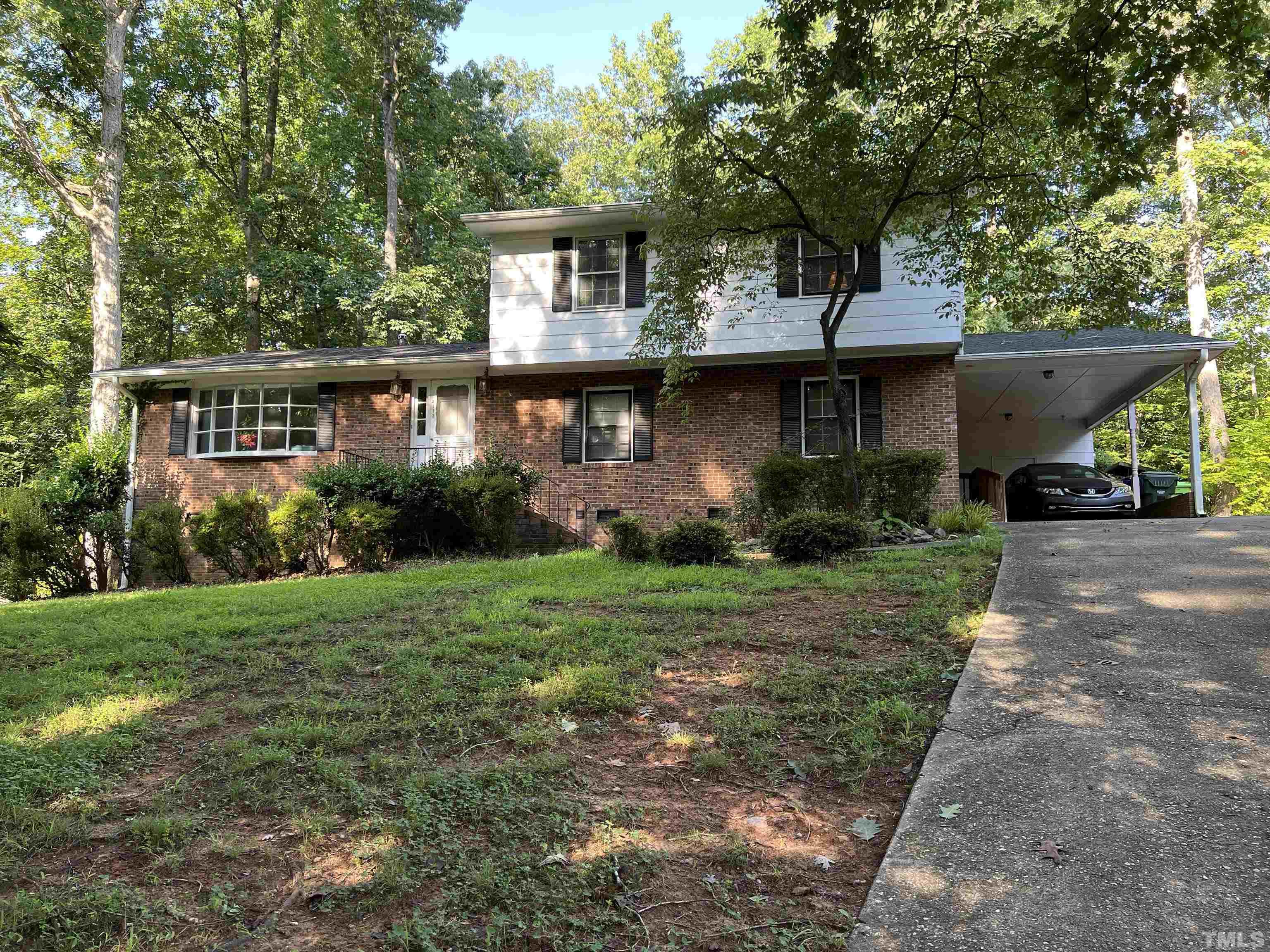 4113 Redington Drive Raleigh, NC 27609 - Photo 3 of 3 a front view of a house with garden