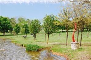 Lot #8 Summit Oaks Circle Denison, TX 75020 - Photo 6 of 13 a view of a garden with trees