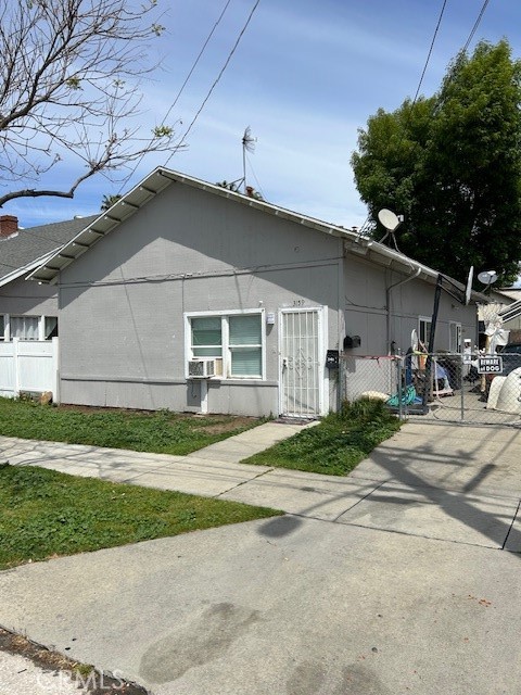 3159 1st Street Riverside, CA 92507 - Photo 4 of 9 a front view of a house with a yard and garage