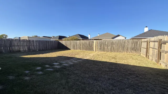 a view of swimming pool with a yard