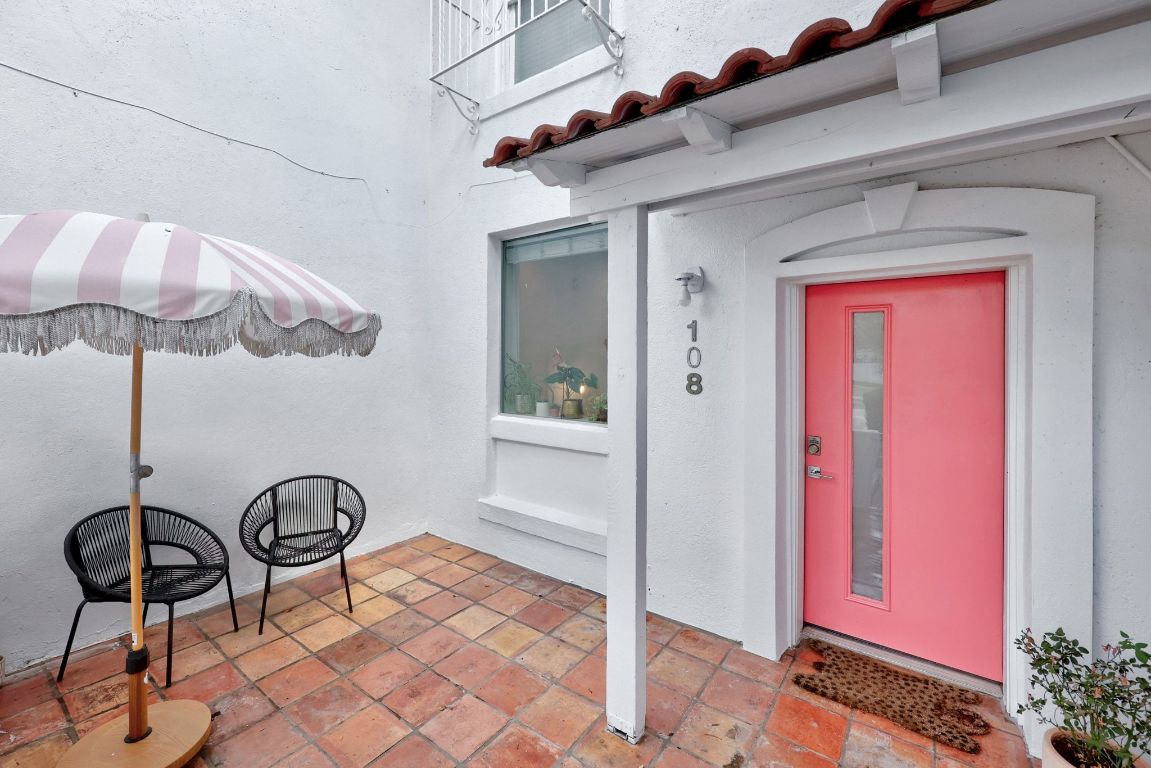 1200 Enfield Road, Unit 205 Austin, TX 78703 - Photo 15 of 22 a view of a room with a table and chairs