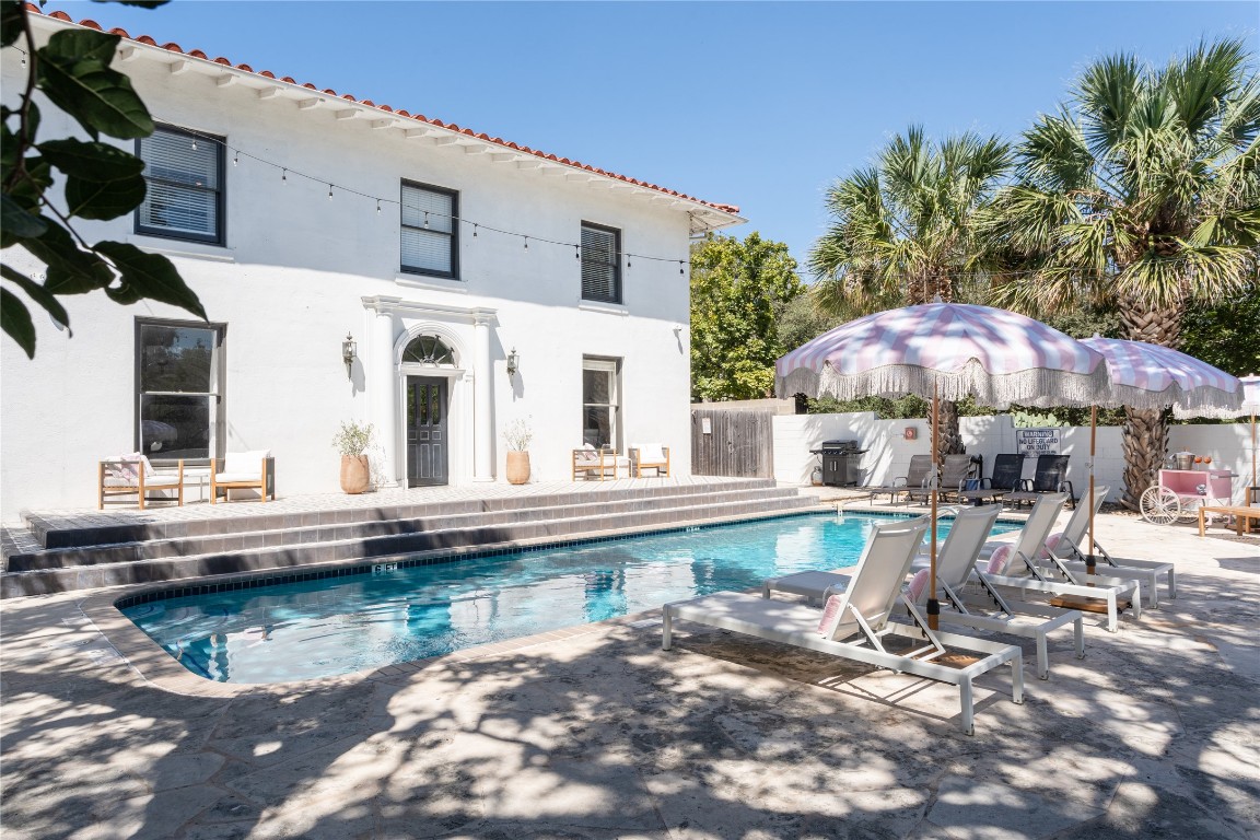 1200 Enfield Road, Unit 205 Austin, TX 78703 - Photo 20 of 22 a view of house with swimming pool outdoor seating area and furniture