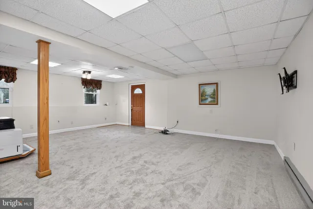 a view of empty room with fireplace