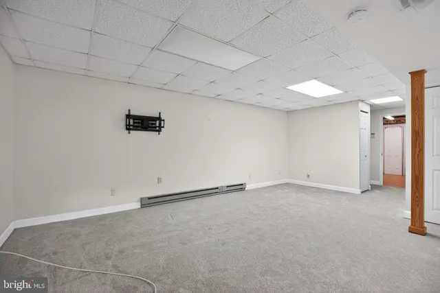 a bathroom with a sink mirror and toilet