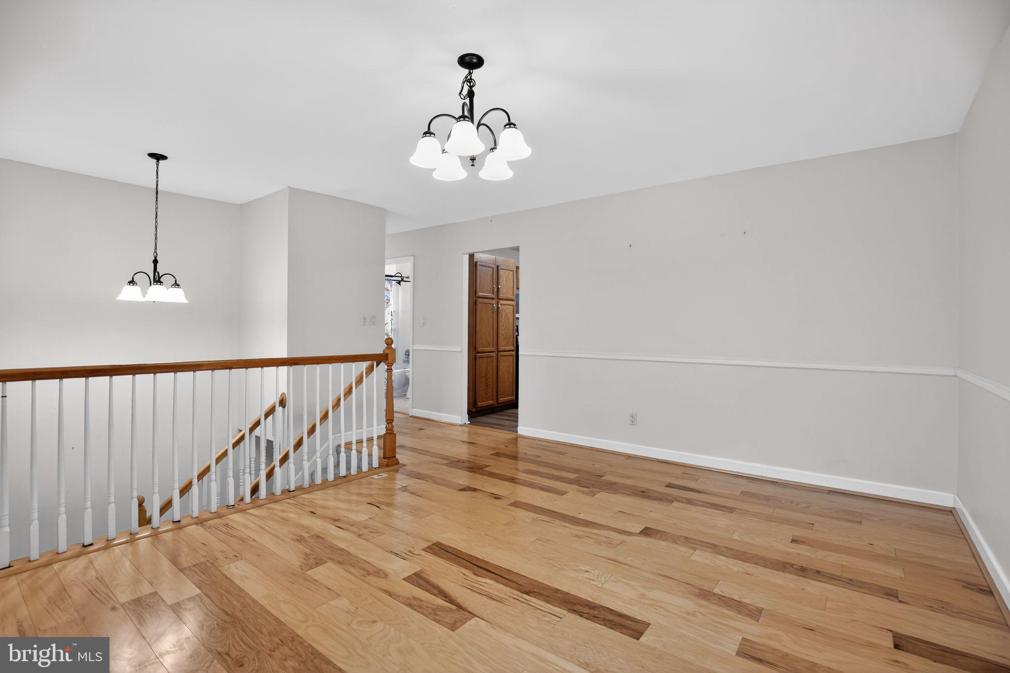 3240 Richfield Road Huntingtown, MD 20639 - Photo 3 of 33 a view of an empty room with wooden floor