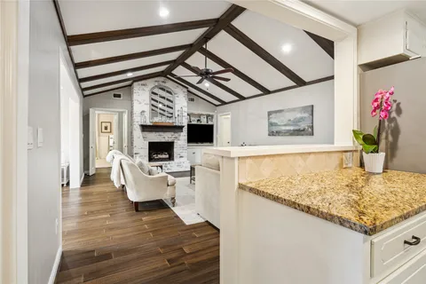 a living room with furniture and flat screen tv
