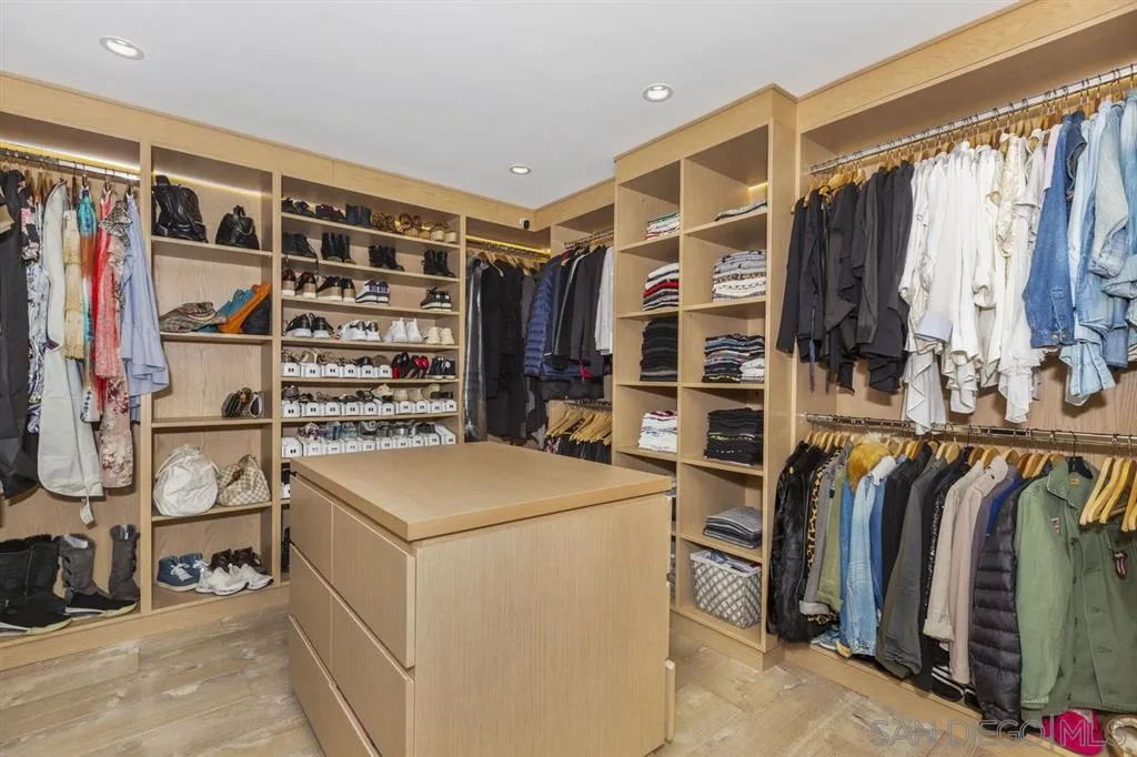 9648 Blackgold Road La Jolla, CA 92037 - Photo 12 of 25 a view of walk in closet with clothes and shoes