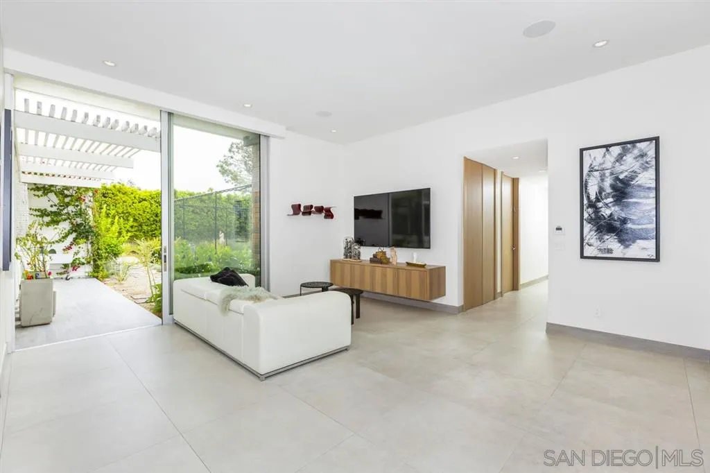 9648 Blackgold Road La Jolla, CA 92037 - Photo 13 of 25 a living room with furniture and flat screen tv