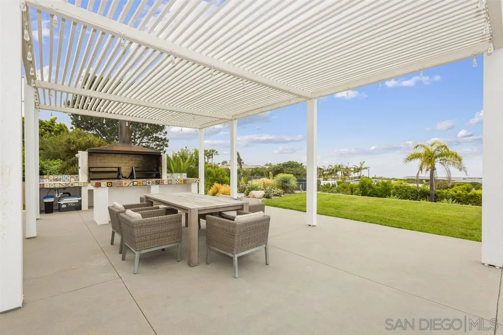 9648 Blackgold Road La Jolla, CA 92037 - Photo 20 of 25 a view of a patio with couches chairs and potted plants