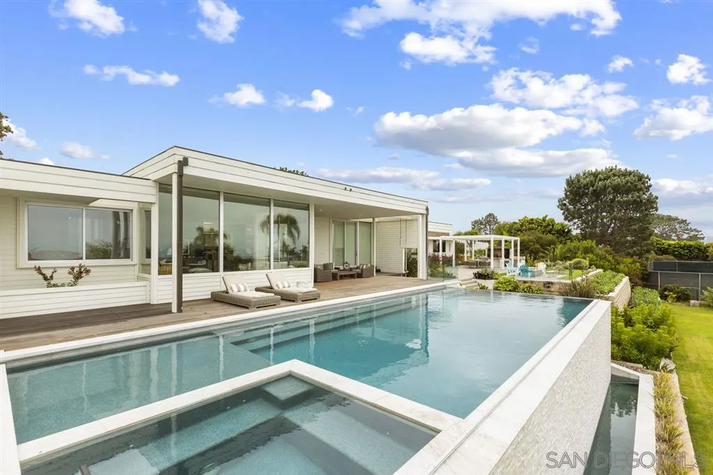 9648 Blackgold Road La Jolla, CA 92037 - Photo 22 of 25 a view of a swimming pool with a lounge chairs