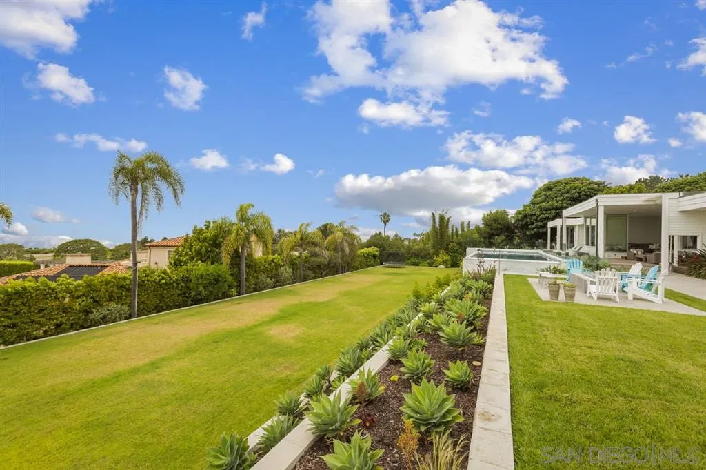 9648 Blackgold Road La Jolla, CA 92037 - Photo 23 of 25 a view of a swimming pool with a table and chairs
