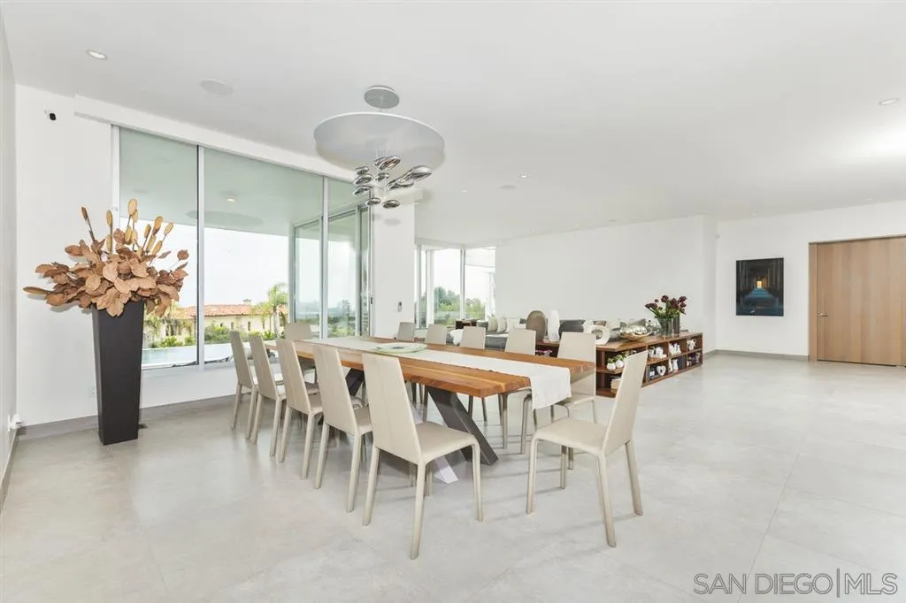 9648 Blackgold Road La Jolla, CA 92037 - Photo 5 of 25 a view of a dining room with furniture and a chandelier