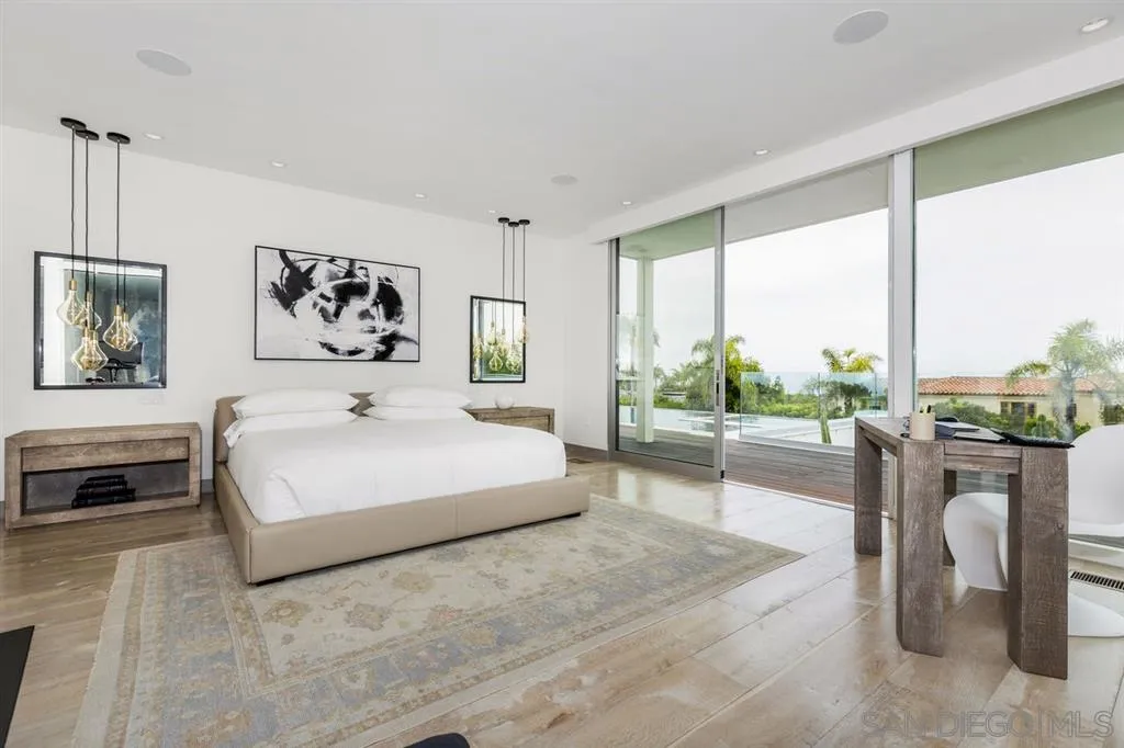 9648 Blackgold Road La Jolla, CA 92037 - Photo 9 of 25 a spacious bedroom with a large bed and a couch
