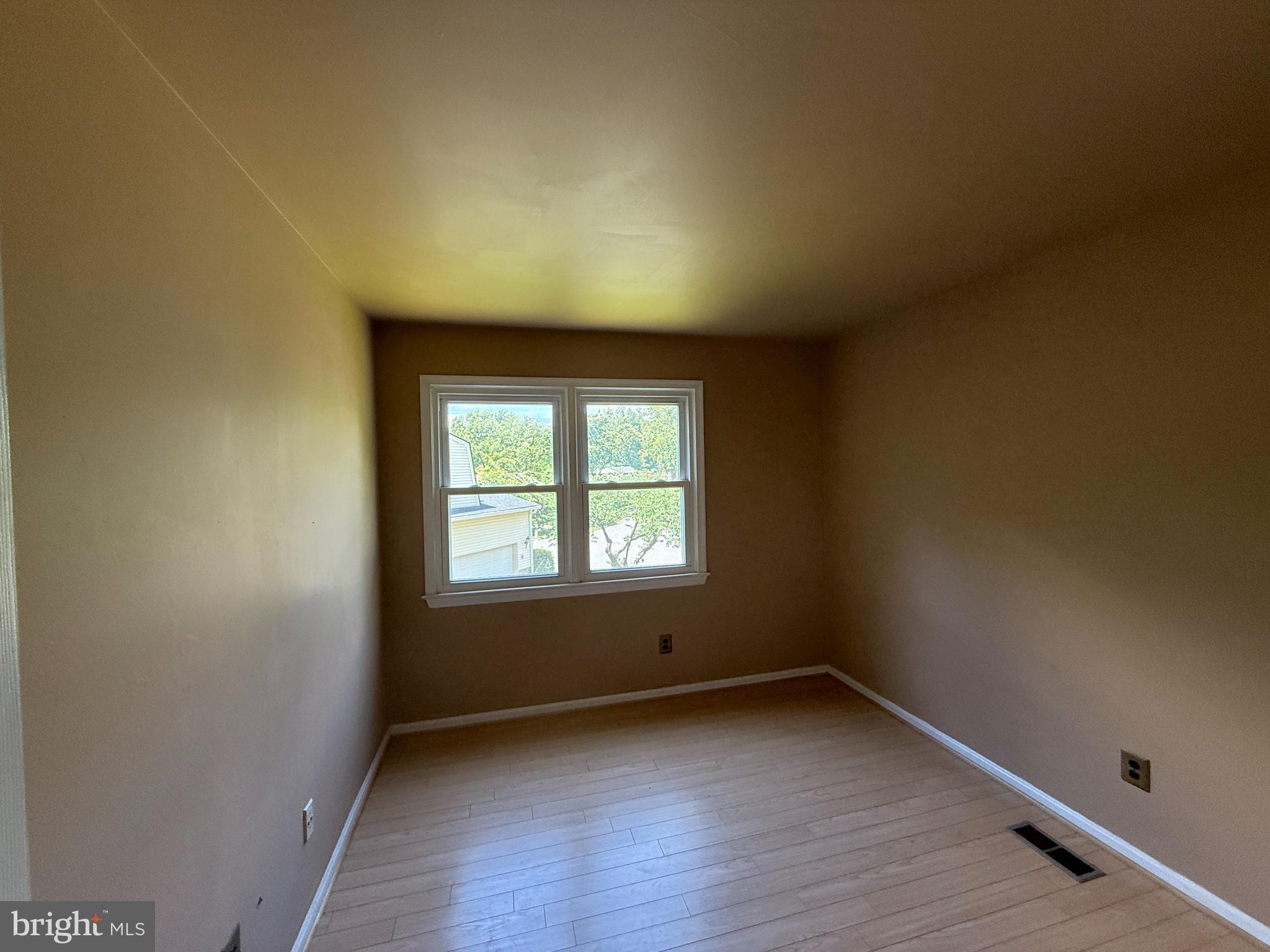 2133 Freda Drive Vienna, VA 22181 - Photo 13 of 35 an empty room with wooden floor and windows