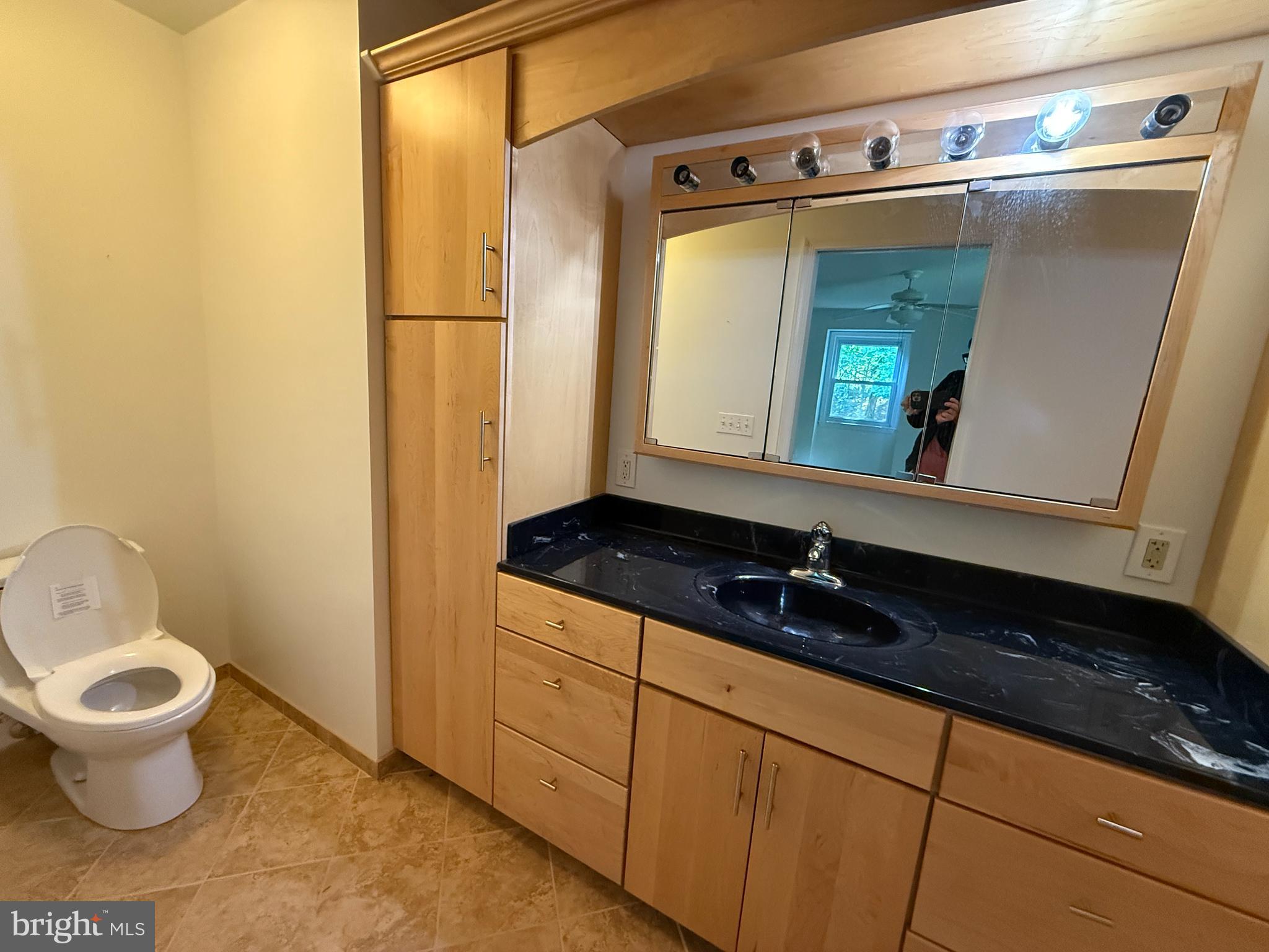 2133 Freda Drive Vienna, VA 22181 - Photo 21 of 35 a bathroom with a toilet sink and mirror