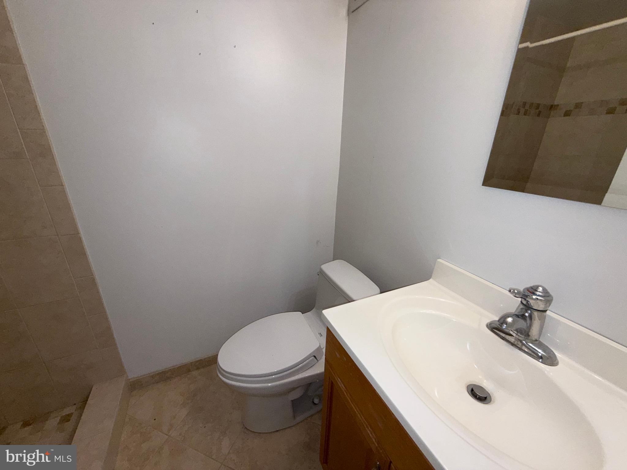 2133 Freda Drive Vienna, VA 22181 - Photo 27 of 35 a bathroom with a sink a toilet and mirror