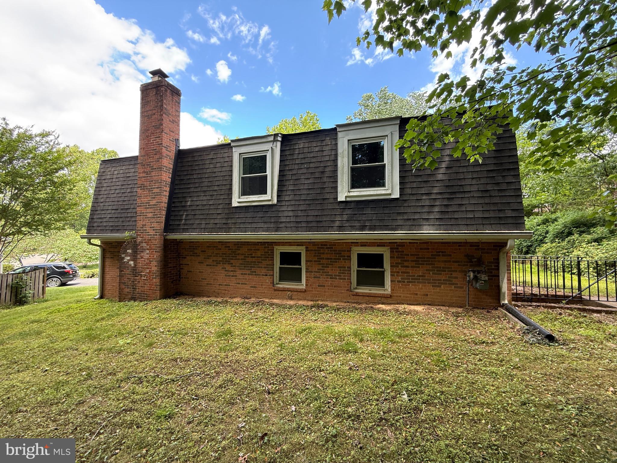 2133 Freda Drive Vienna, VA 22181 - Photo 4 of 35 a front view of a house with a yard and garage