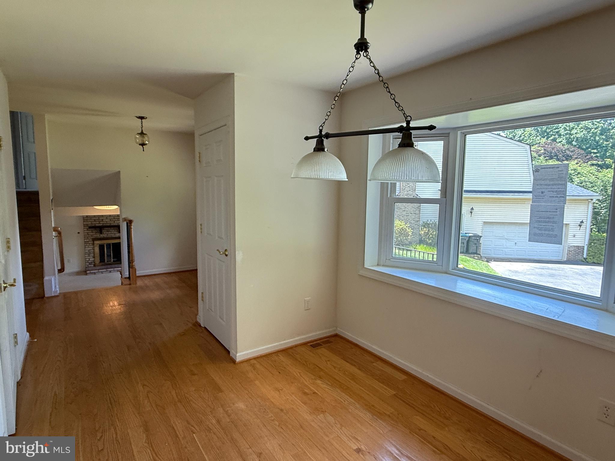 2133 Freda Drive Vienna, VA 22181 - Photo 6 of 35 a view of empty room with wooden floor and fan