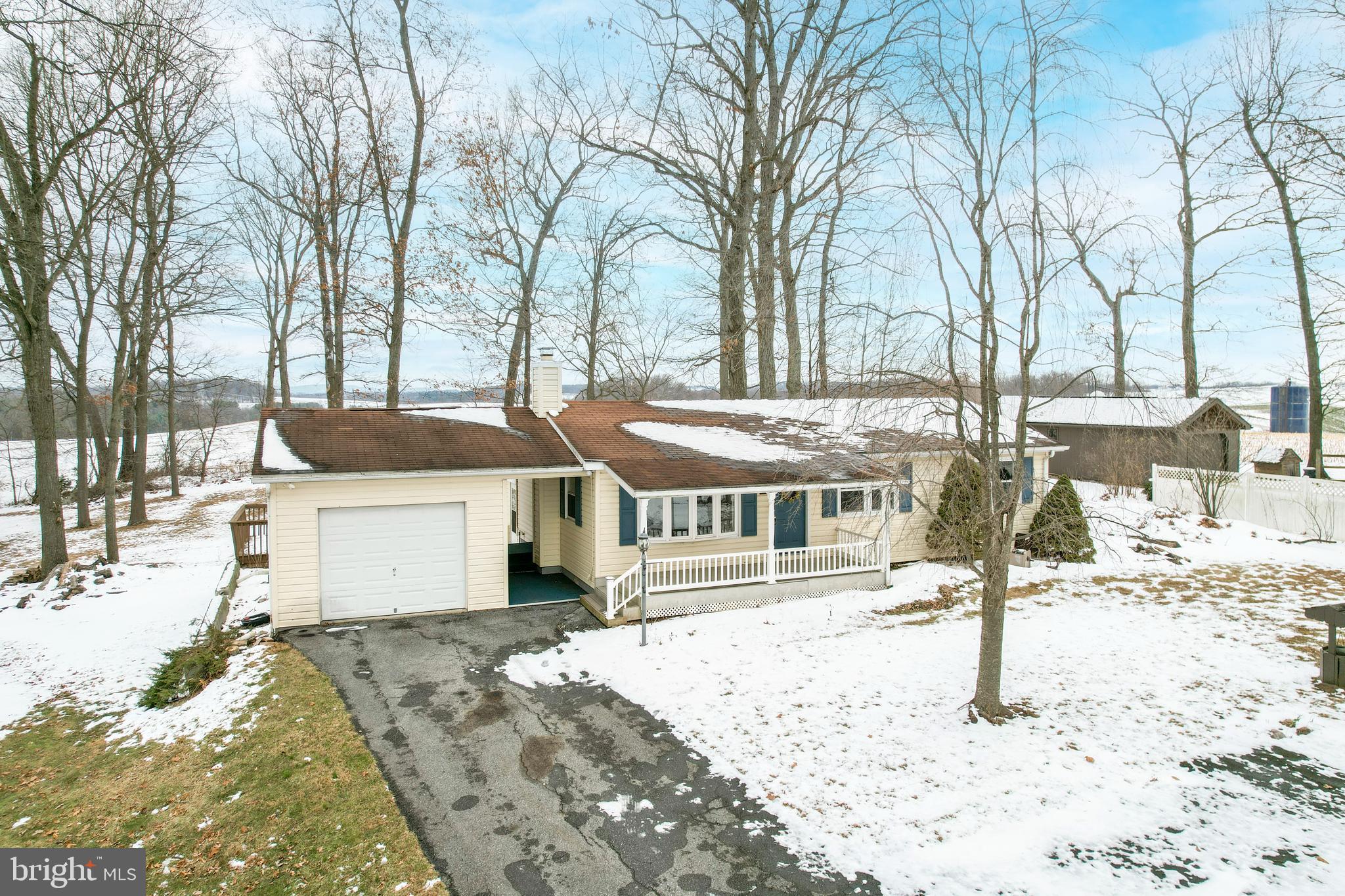 16 Leppo Road Westminster, MD 21158 - Photo 25 of 46 a front view of a house with a yard covered with snow