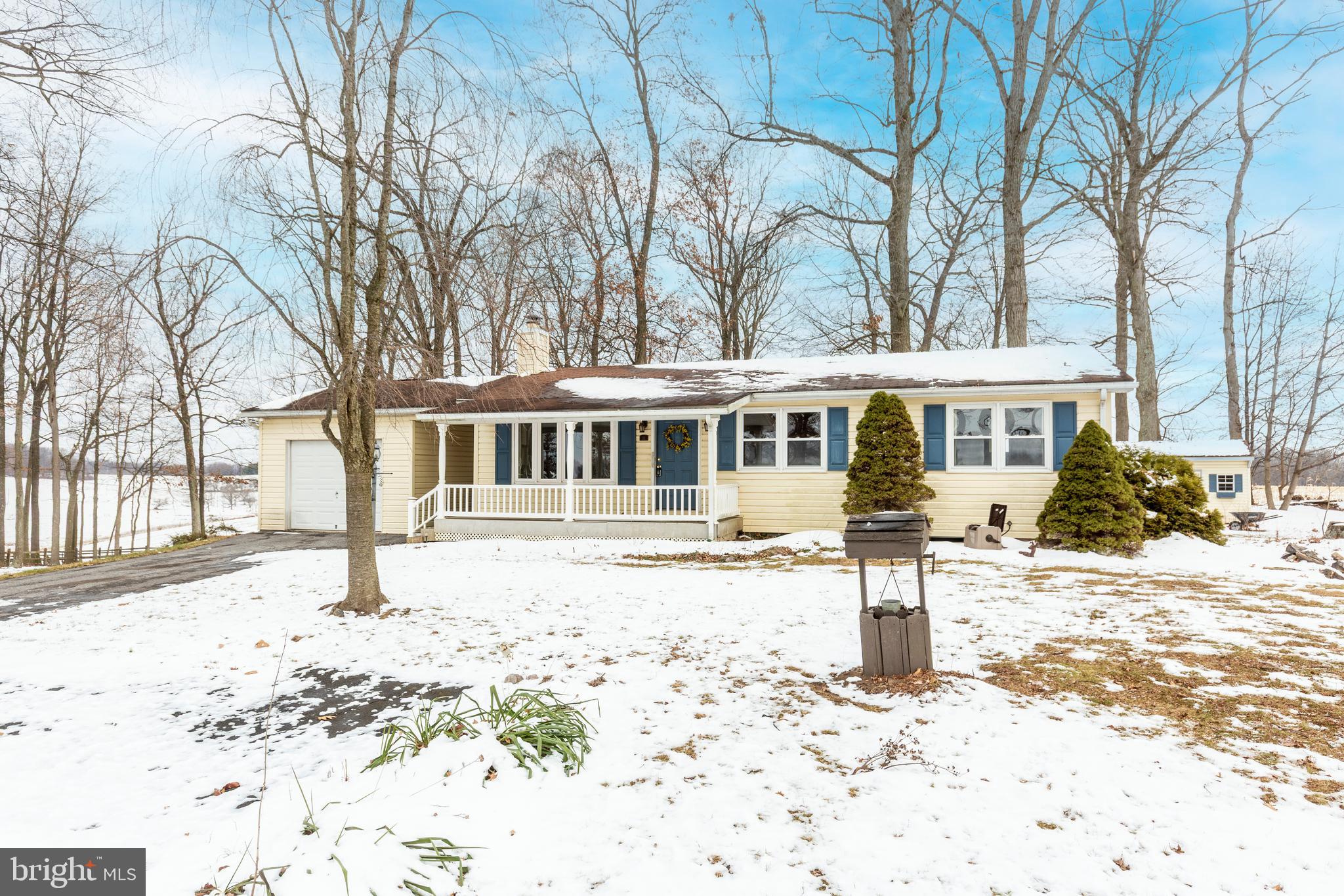 16 Leppo Road Westminster, MD 21158 - Photo 26 of 46 a front view of a house with a yard covered in snow