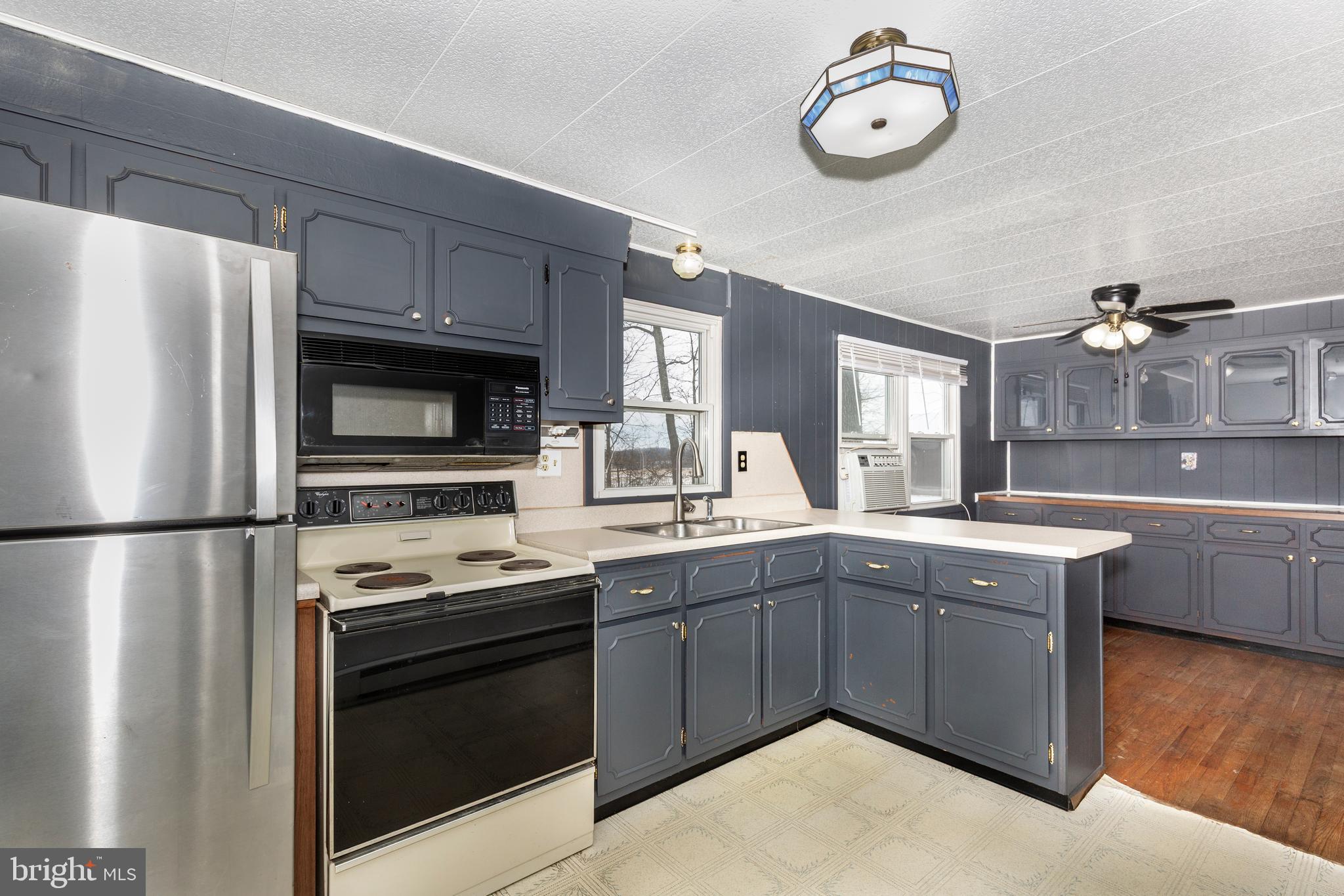 16 Leppo Road Westminster, MD 21158 - Photo 8 of 46 a kitchen with stainless steel appliances a stove a sink and a refrigerator