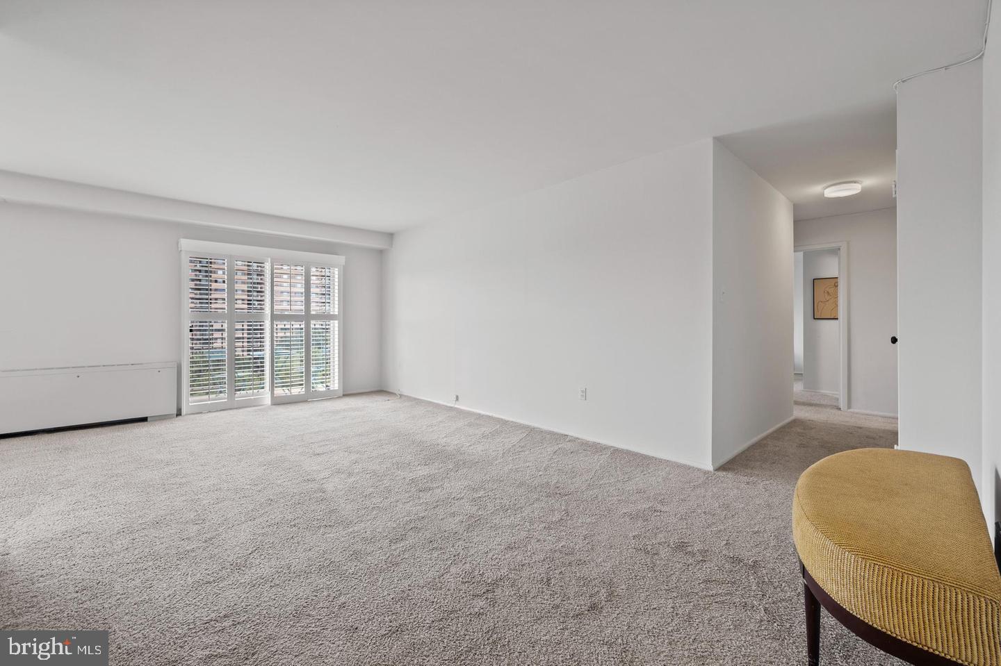 1111 University Boulevard West, Unit 815 Silver Spring, MD 20902 - Photo 2 of 14 a view of an empty room with a window