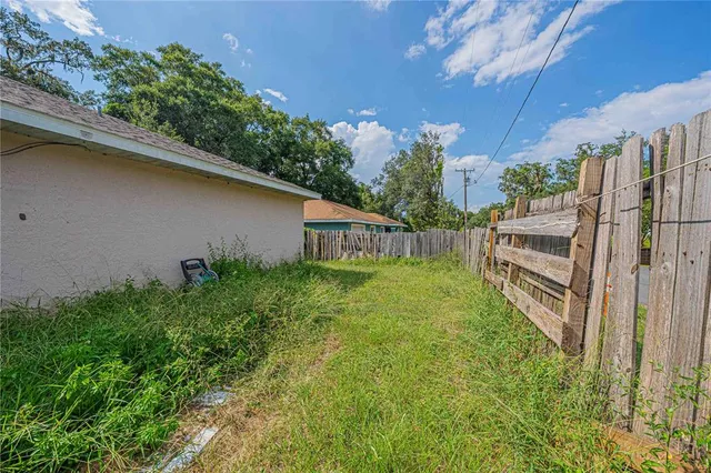 a view of backyard with green space