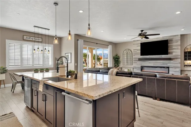 a kitchen with stainless steel appliances granite countertop a sink stove oven and refrigerator