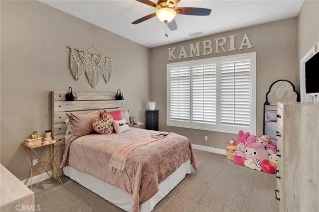 a bedroom with a bed and cabinets