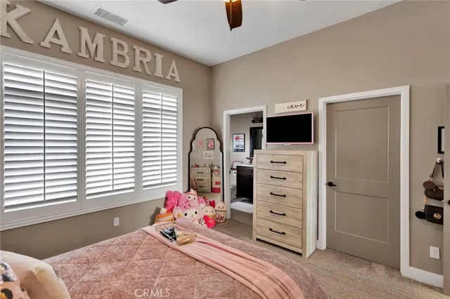 a bathroom with a granite countertop sink toilet and a mirror