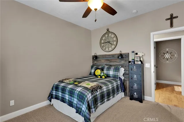 a bathroom with a granite countertop double vanity sinks and a mirror