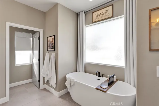 a view of a swimming pool with an outdoor seating and a yard