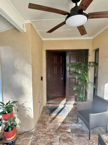 a view of entryway with a flower garden