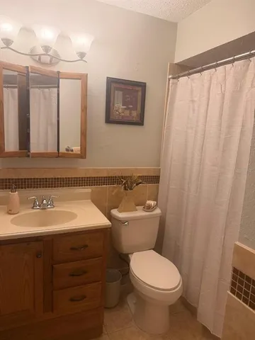 a kitchen with a table and chairs