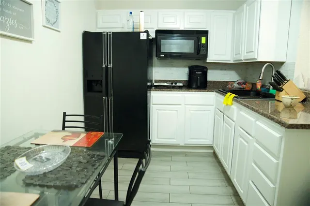 a bathroom with a sink and a shower