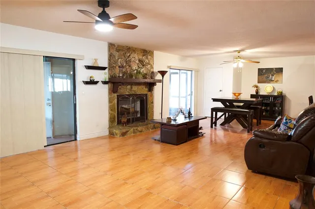 a living room with furniture and fireplace