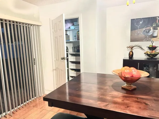 a view of dining room and wooden floor