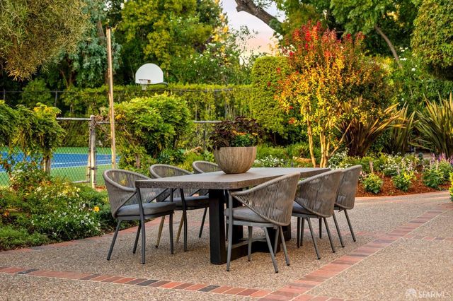 a view of a dining room with furniture and window