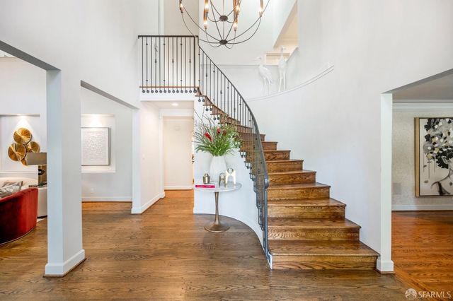 a view of a kitchen with kitchen island granite countertop lots of counter top space