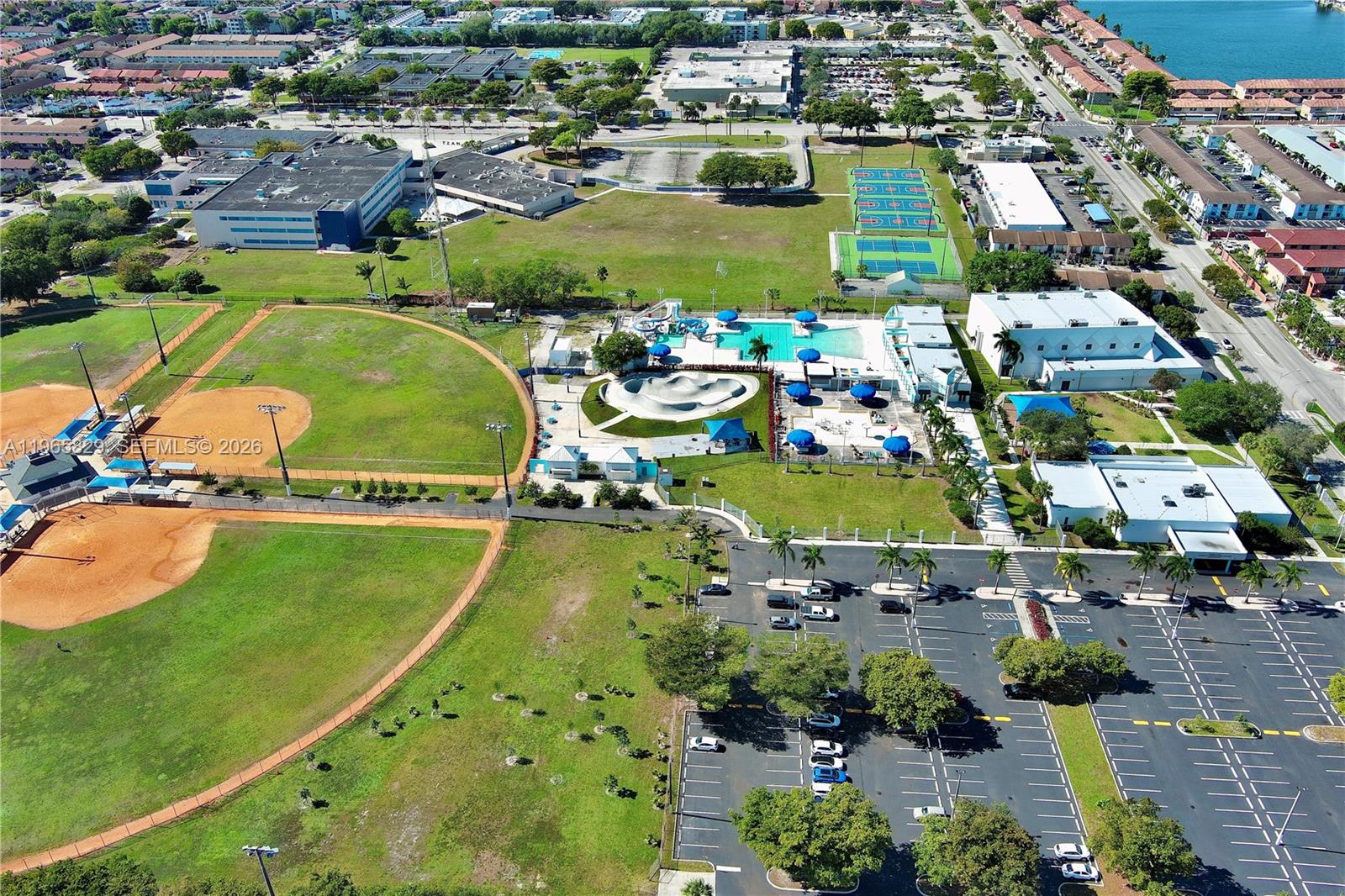 2162 West 60th Street, Unit 14203 Hialeah, FL 33016 - Photo 22 of 23 an aerial view of a houses with a swimming pool
